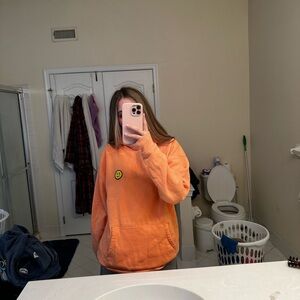 Light orange gilly hicks smiley face hoodie size large